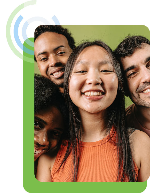 Group of young adults smiling together for a close-up photo